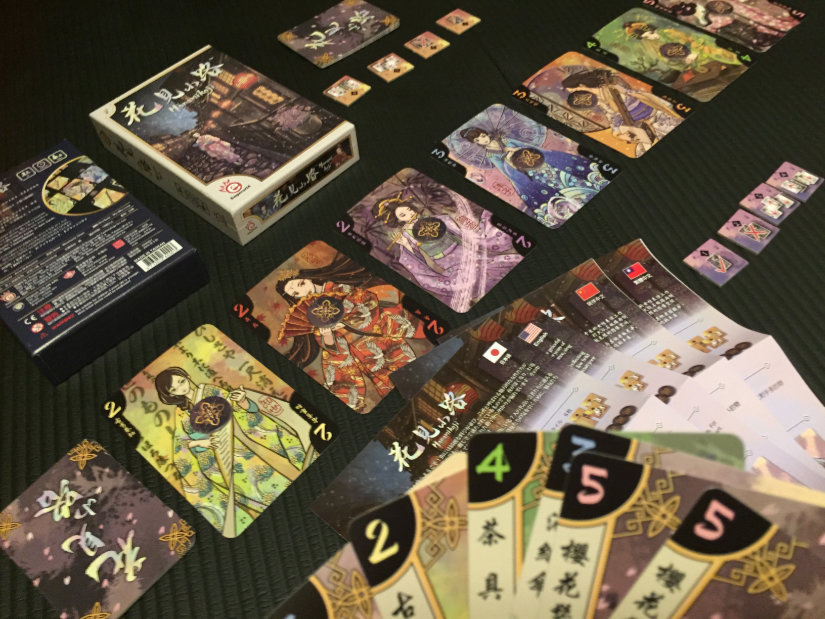 Hanamikoji contents - 7 geisha cards and 7 types of tool cards. Victory and action tokens. Rules in multiple languages