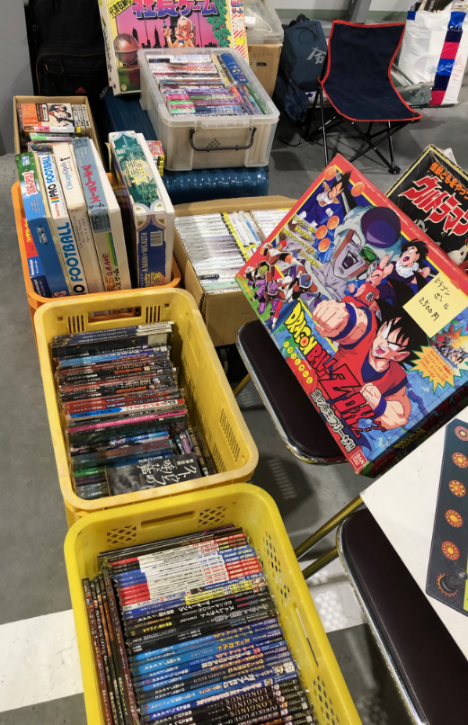 Used books in creates and games on shelves