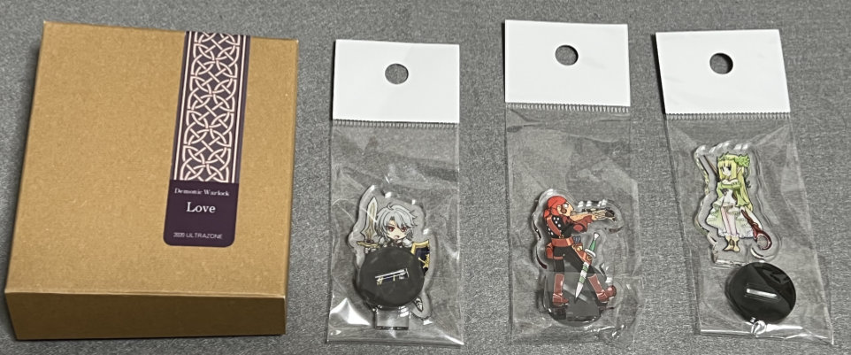 Acrylic miniatures from Kaki no Tane and a 3d miniature in a box.
