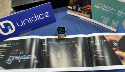 The unidice digital die with promotional material.