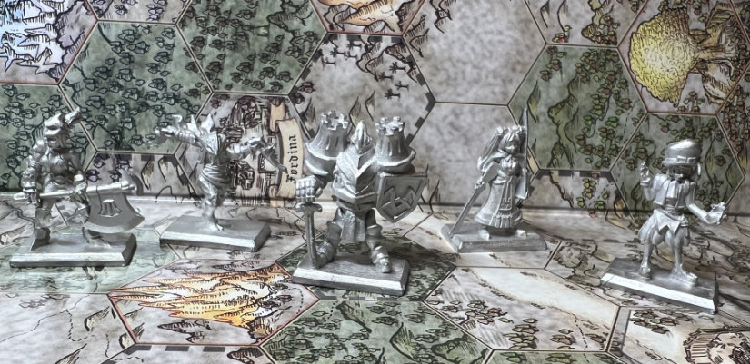 The five metal miniatures on the game map. Left to right: Gladiator, Ninja, Paladin, Hunter, and Prince.