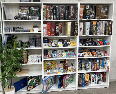 Board and miniature games on the shelf.
