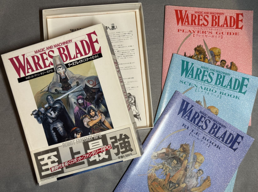 Wares Blade box open, its three booklets to the side.